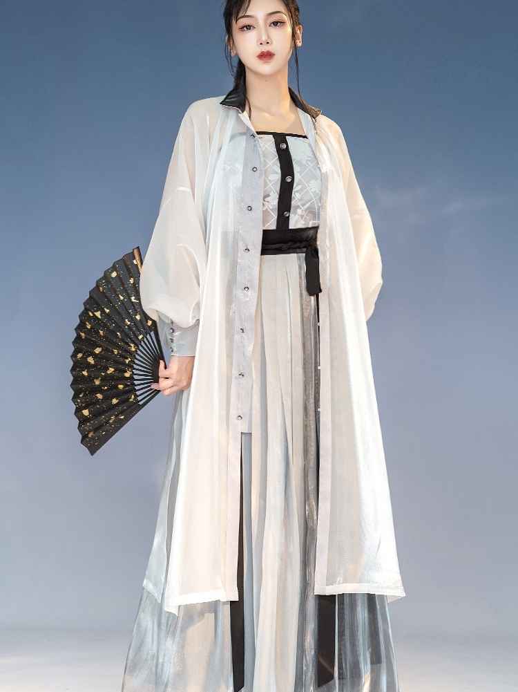 White Featuring a diverse collection of Hanfu styles, this display presents a blend of traditional and modern elements, from the intricate embroidery of classic Hanfu to contemporary menswear. The assortment includes authentic Tang Dynasty dresses and detailed Ming Dynasty Hanfu, alongside luxurious royal attire and scholar officials' outfits. With a special emphasis on men's Hanfu, the exhibit highlights the rich cultural tapestry of traditional Asian clothing and modern, Asian-inspired fashion