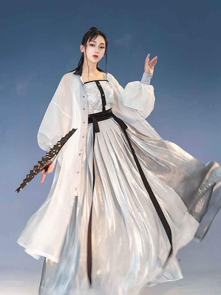 White Featuring a diverse collection of Hanfu styles, this display presents a blend of traditional and modern elements, from the intricate embroidery of classic Hanfu to contemporary menswear. The assortment includes authentic Tang Dynasty dresses and detailed Ming Dynasty Hanfu, alongside luxurious royal attire and scholar officials' outfits. With a special emphasis on men's Hanfu, the exhibit highlights the rich cultural tapestry of traditional Asian clothing and modern, Asian-inspired fashion